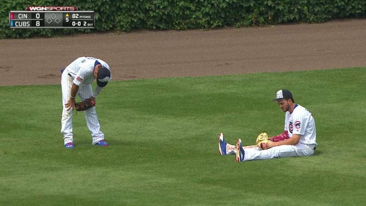 Bryant homers, pulled after outfield collision