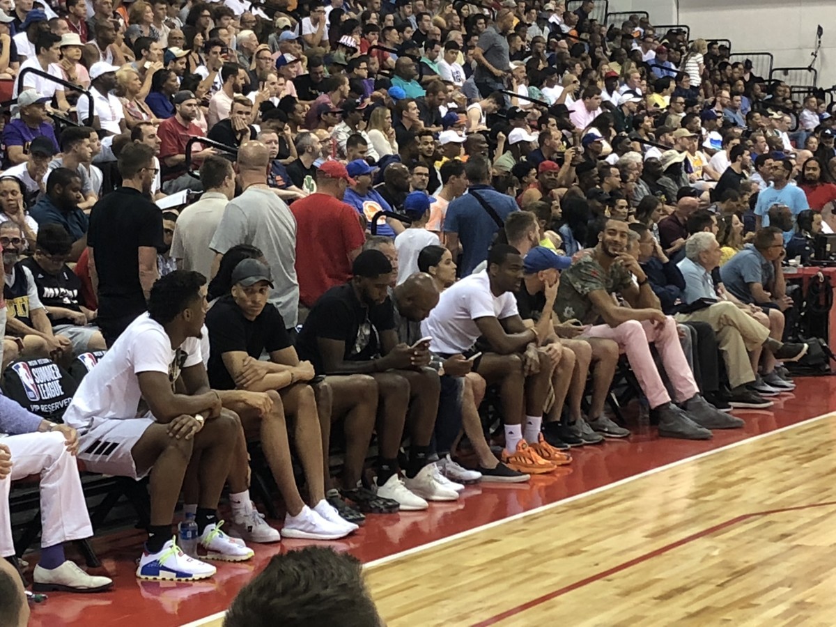Seven Utah Jazz players display unison by filling courtside row for NBA