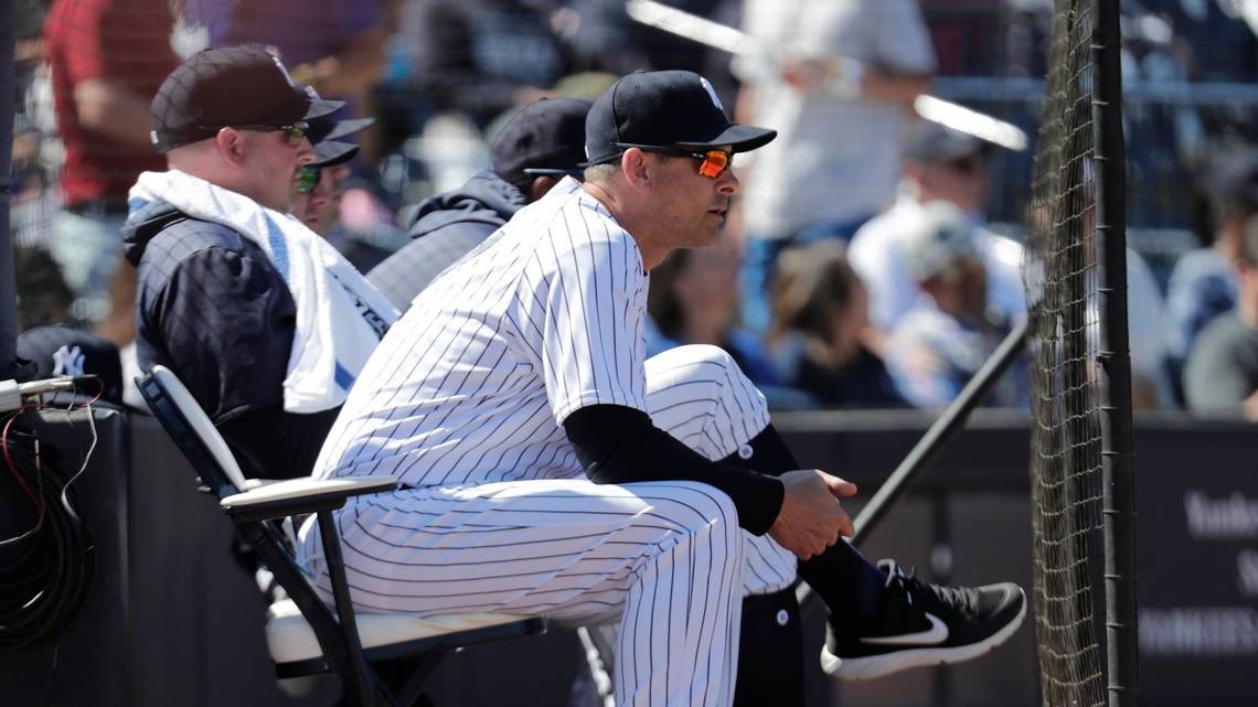 Why do managers and coaches sit outside the dugout during spring