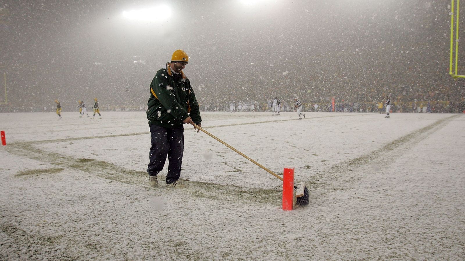 Lambeau Field is covered in snow, forecast for snow showers during