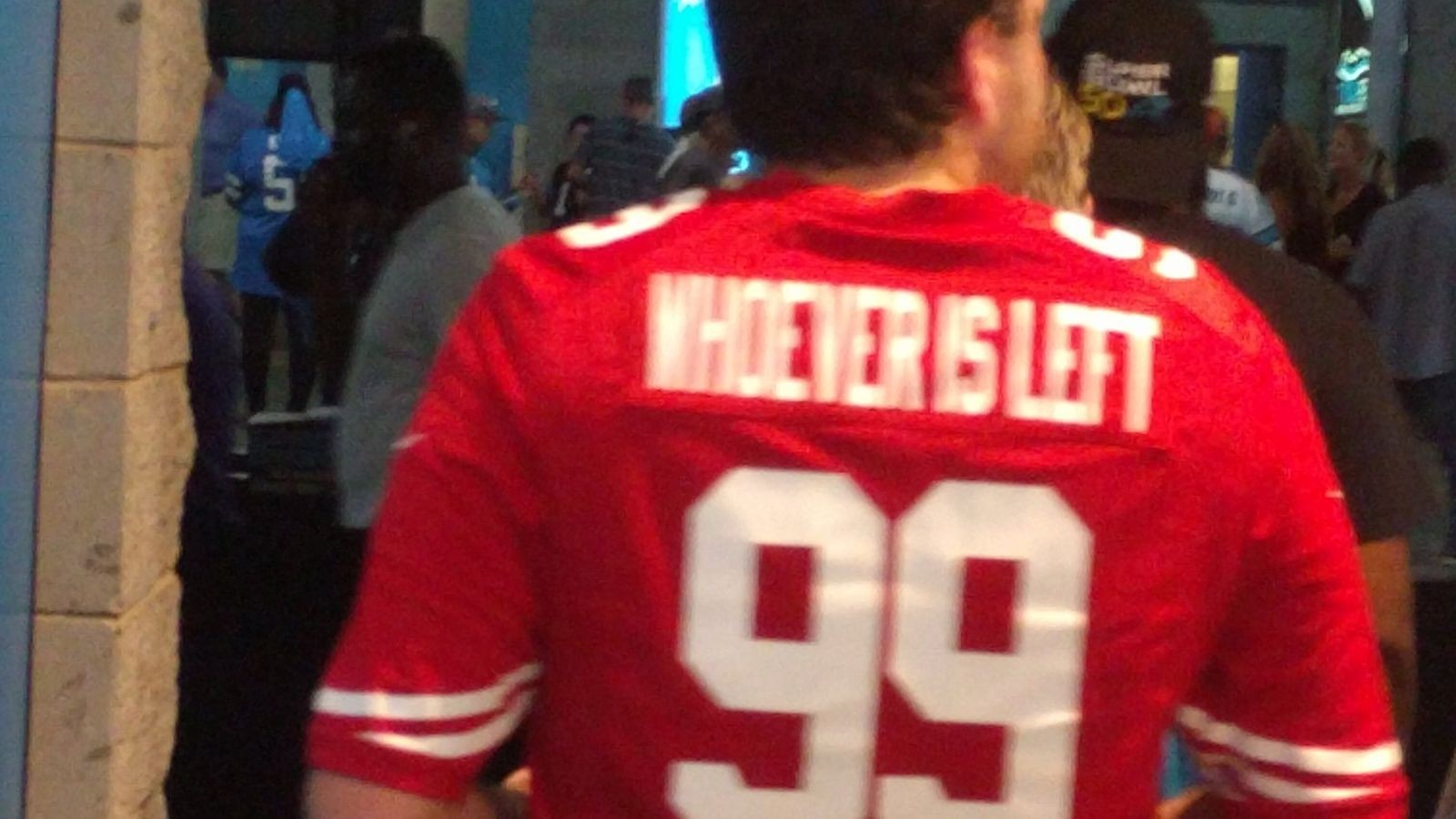 49ers fan sports fantastic customized jersey at Panthers game