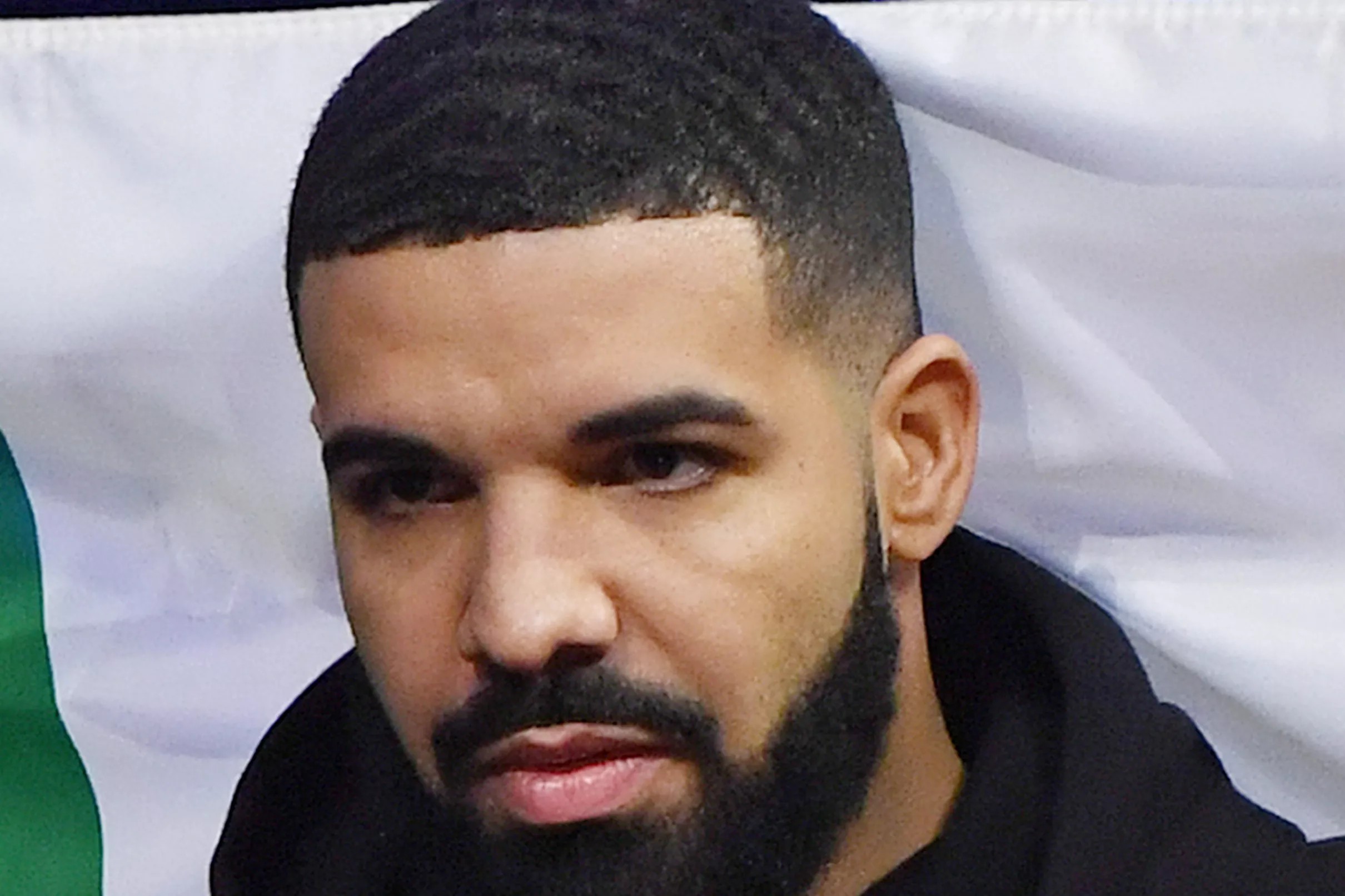 Drake appears in Devin Booker Moss Point jersey at Phoenix