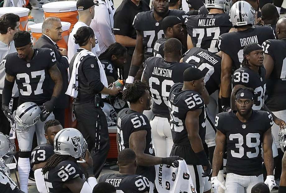 Raiders’ Marshawn Lynch sits during national anthem