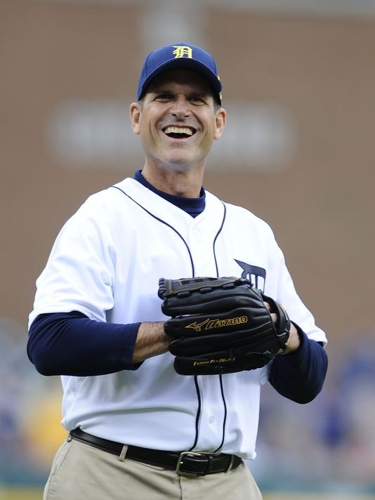 Harbaugh will coach first base for Tigers in Florida