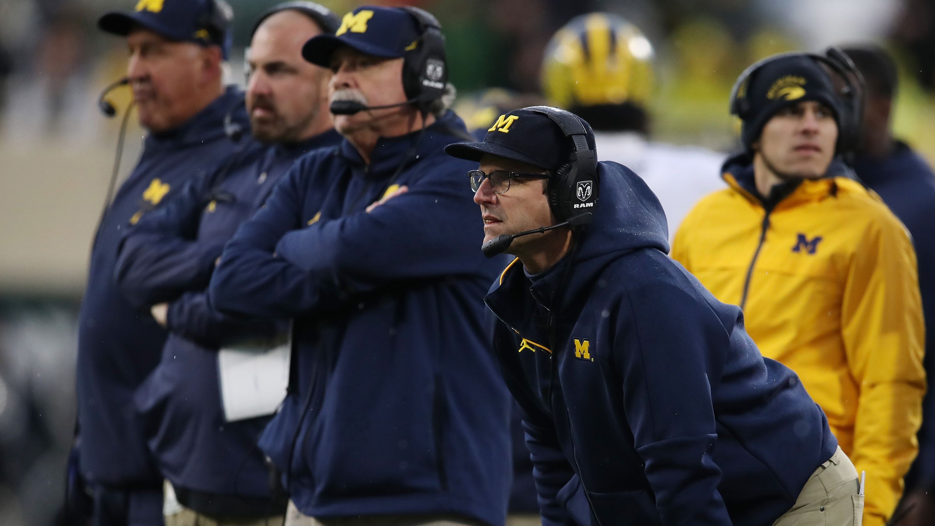 Michigan football coaching staff's two different, effective approaches