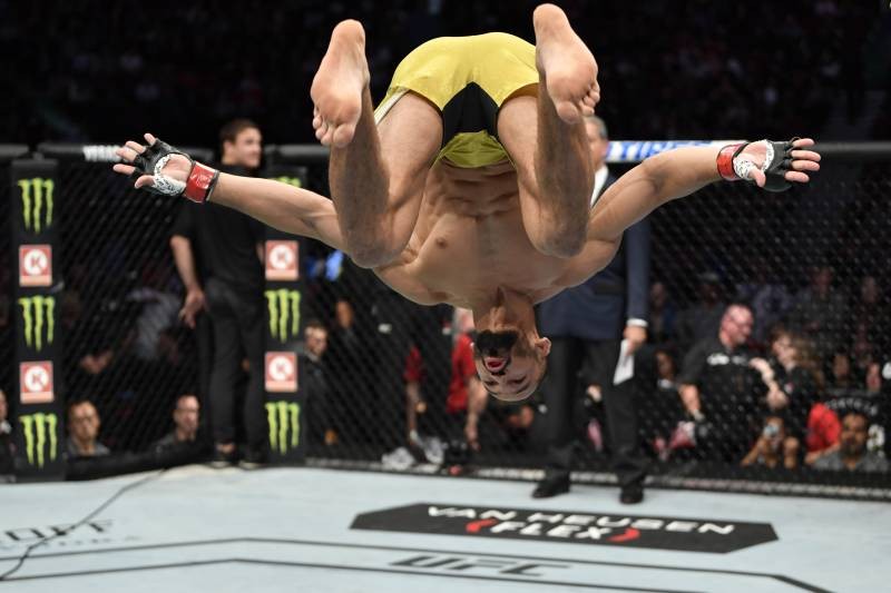 Backflips, Flying Kicks and More Ranking the Craziest Moves in MMA History