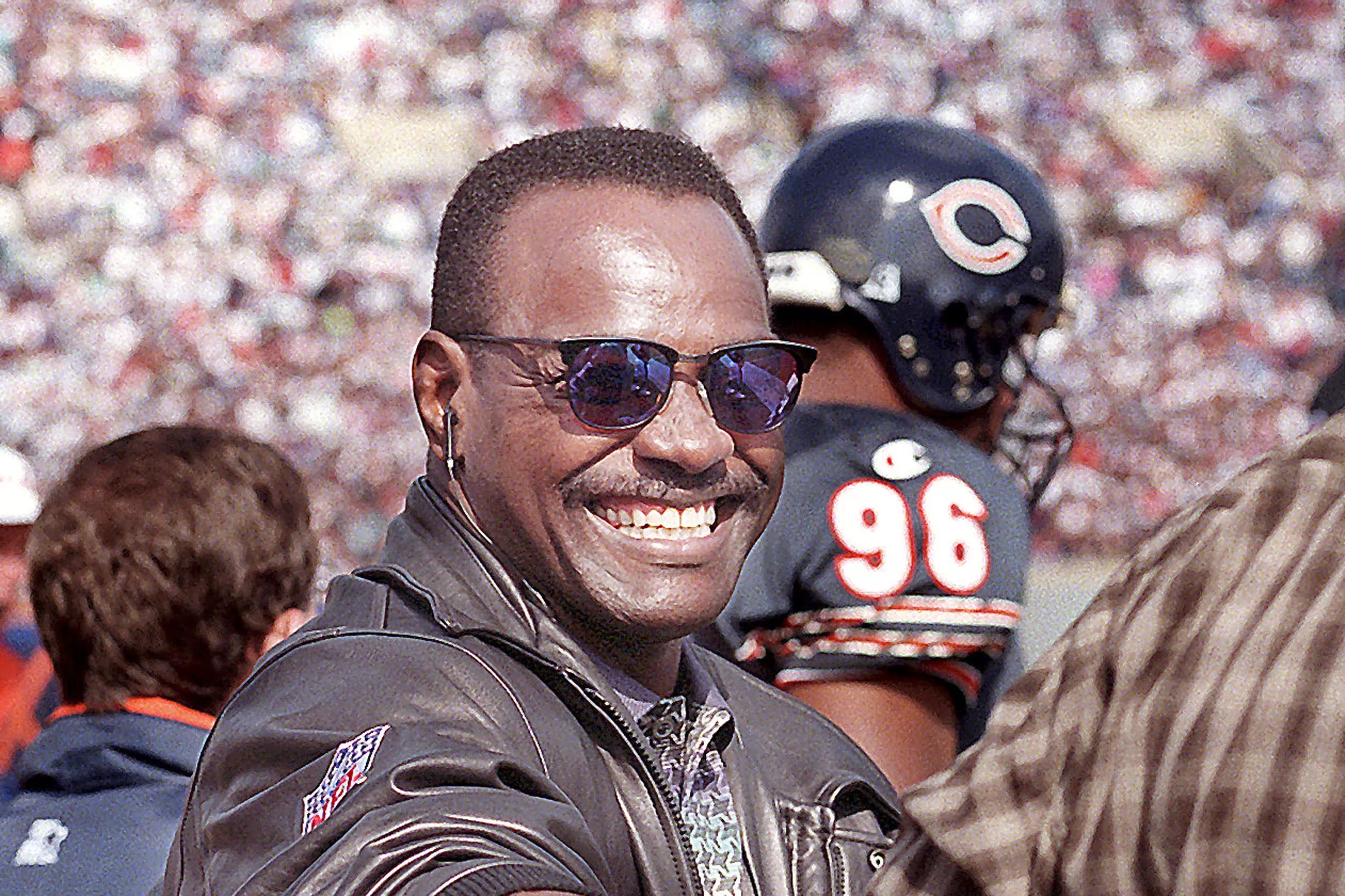 Two Bears icons &mdash; running back Walter Payton and founder Geor...