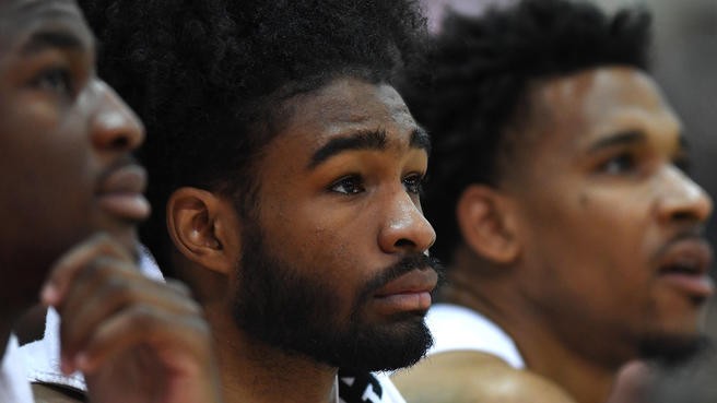 Kris Dunn visits young basketball campers, former coach at