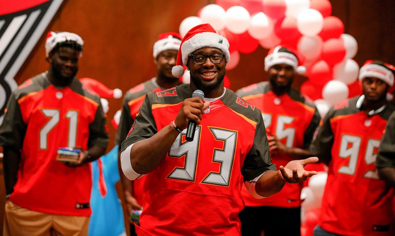 Bucs D-Line delivers special Christmas for kids