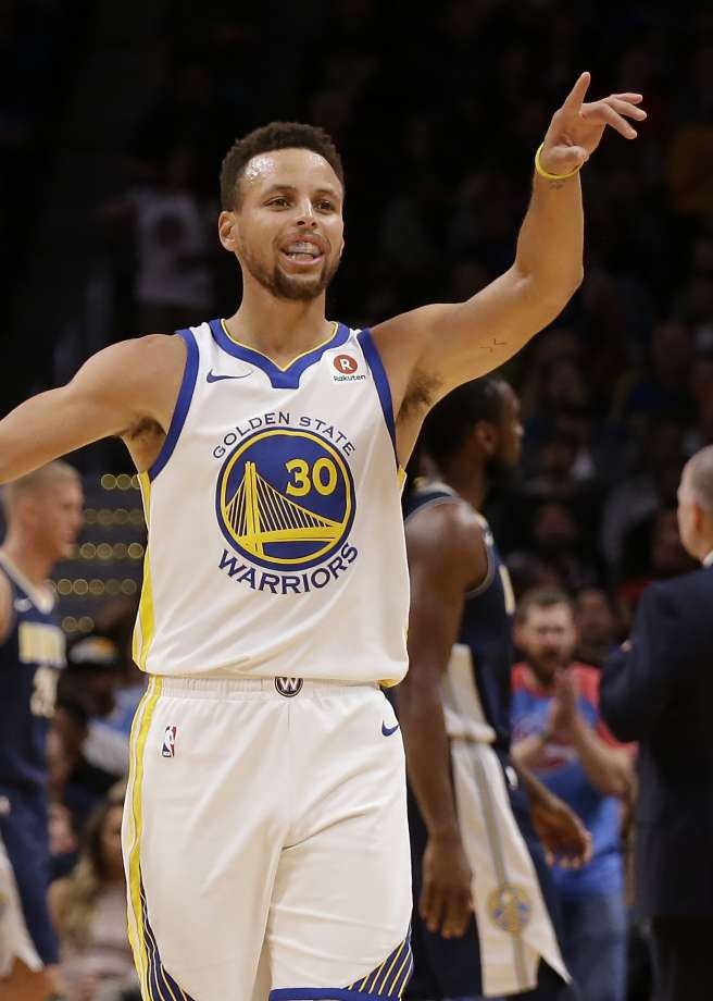 Insane trick shot: Watch Steph Curry punt a basketball straight through