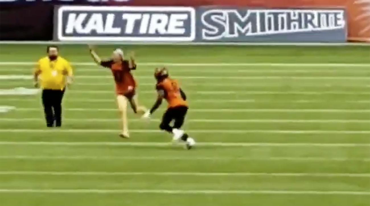 Watch Fan Runs On the Field During CFL Game and Gets Crushed by a Player