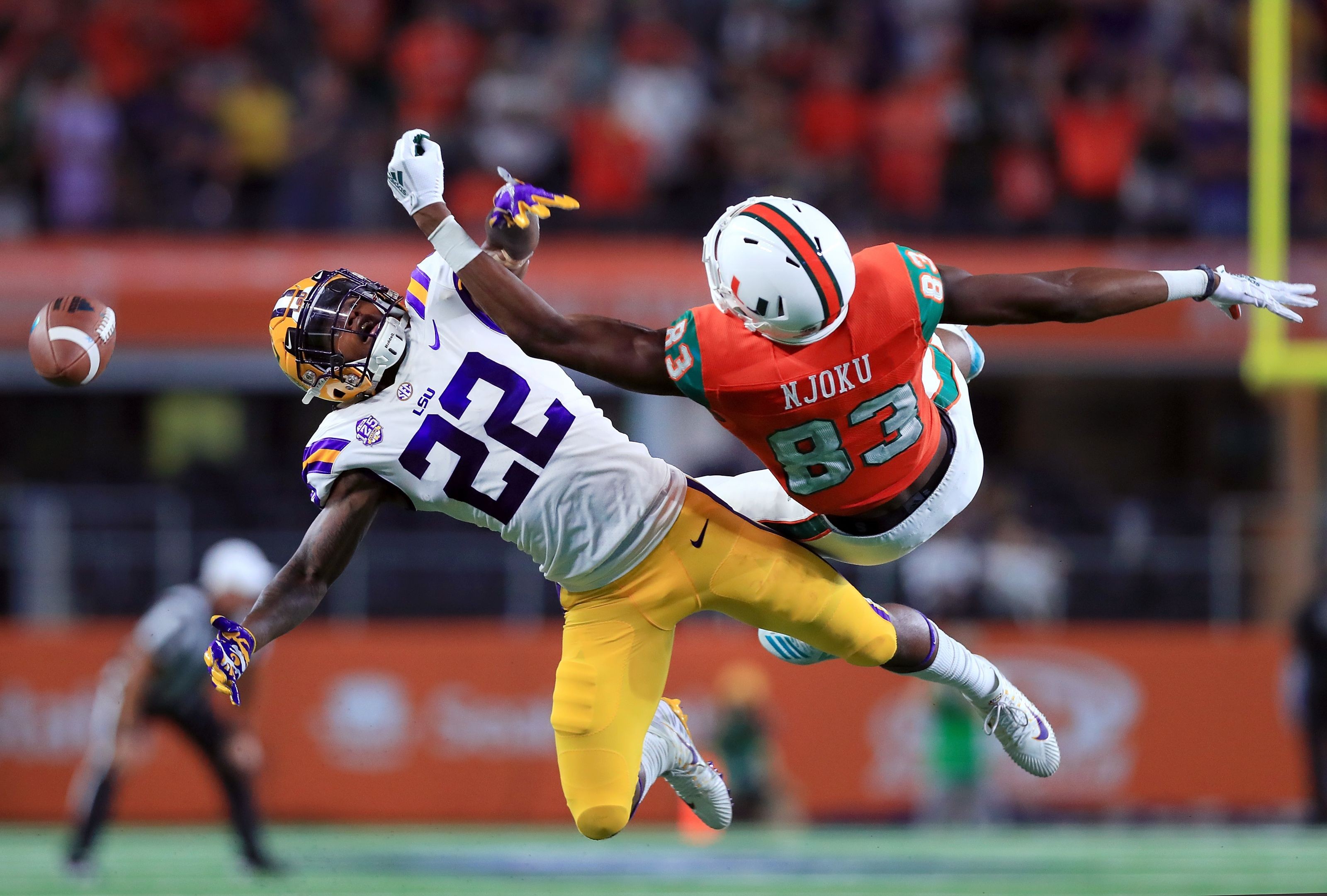 Miami receiver Evidence Njoku (83) poses with his brother, Cleveland Browns  tight end David Njoku, after the Miami NCAA college football Spring Game  Saturday, April 20, 2019, in Orlando, Fla. (Phelan M.