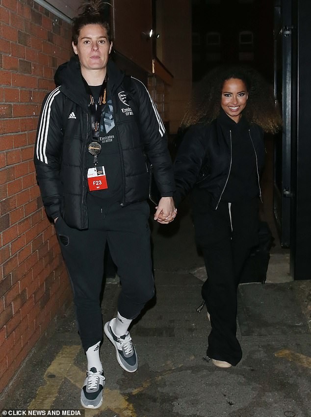 Love Island's Amber Gill holds hands with footballer girlfriend Jen Beattie as they depart