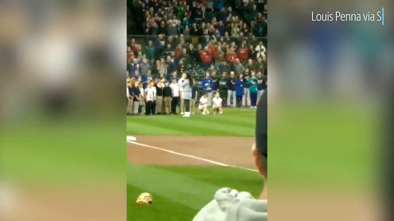 Why did 2 sixthgraders kneel during national anthem at a Mariners game