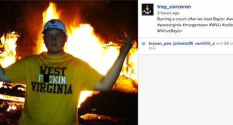 West Virginia Football Fan Poses In Front Of Burning Couch