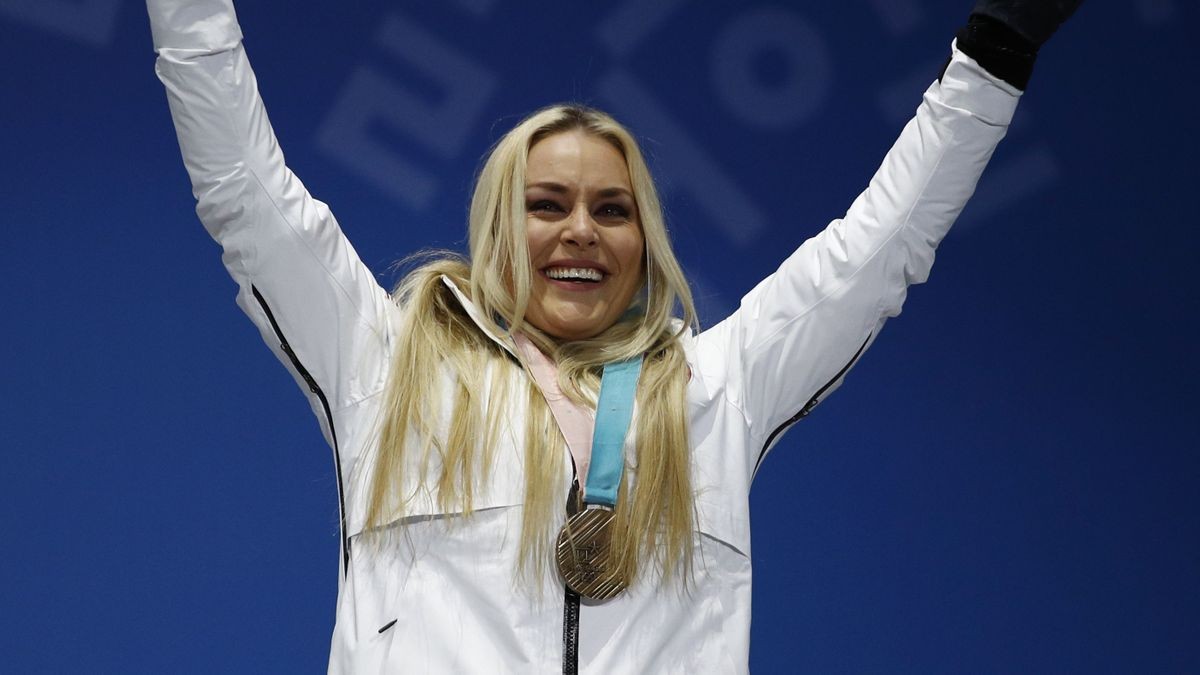 The Latest: Bjoergen becomes most decorated Winter Olympian