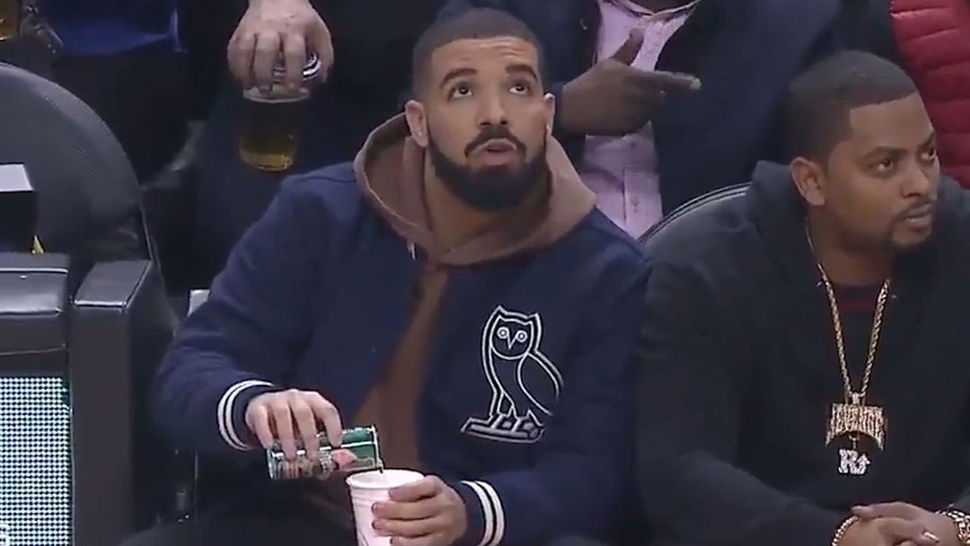 Drake Caught On Camera Pouring Drink at Raptors Game